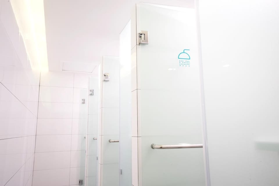 Shower, hair dryer, slippers, towels