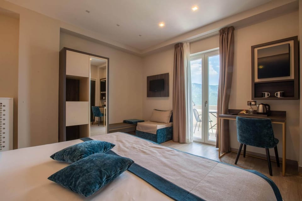 Deluxe Double or Twin Room, Sea View | Minibar, in-room safe, desk, laptop workspace