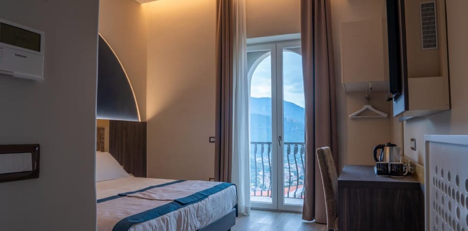 Superior Double or Twin Room, Sea View | Minibar, in-room safe, desk, laptop workspace