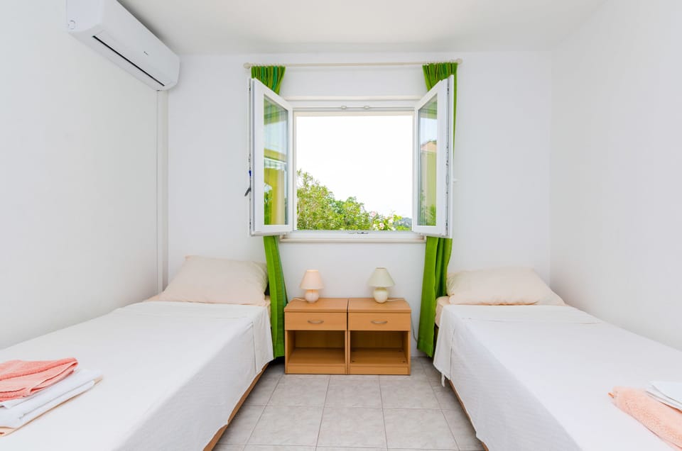 Twin Room, Patio, Garden View | Individually decorated, individually furnished, free WiFi, bed sheets