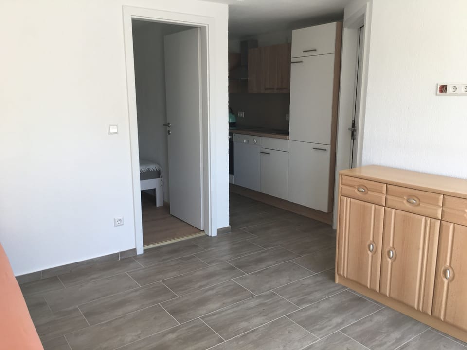 Basic Apartment, 1 Bedroom | Living area | Flat-screen TV
