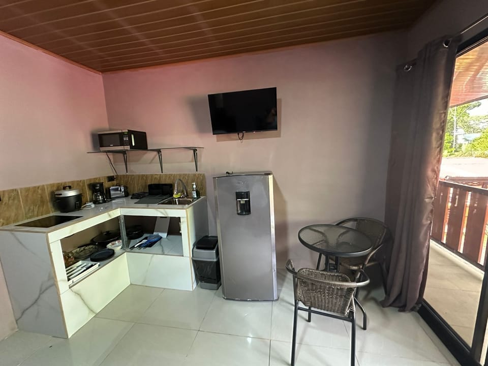 Family Triple Room | Private kitchen | Full-size fridge, microwave, oven, stovetop