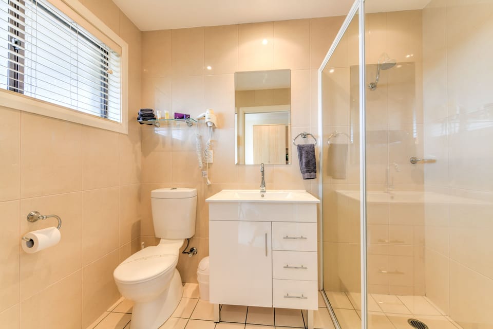 Shower, rainfall showerhead, hair dryer, towels