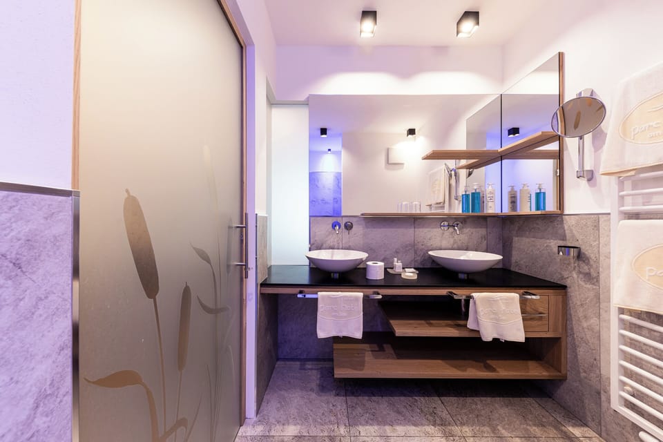 Family Suite | Bathroom | Bathrobes, slippers, towels, soap