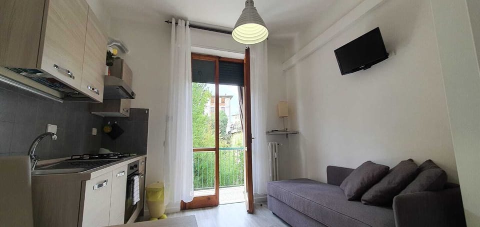 Family Studio | Living area | 28-inch flat-screen TV with digital channels, TV