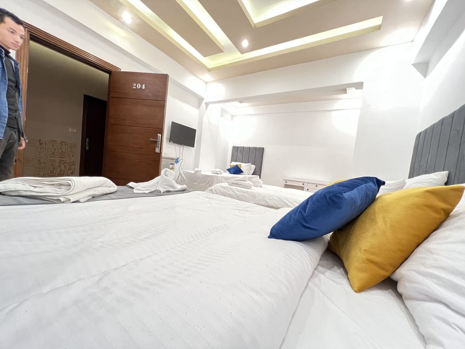 Triple Room | Minibar, blackout drapes, WiFi (free), individually decorated
