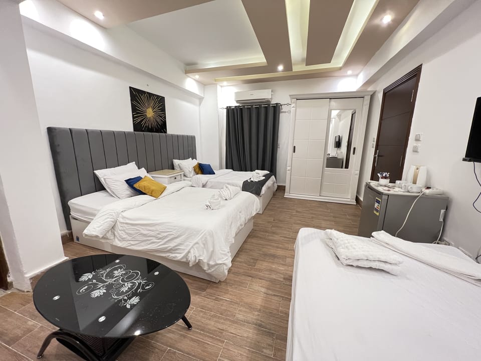 Triple Room | Minibar, blackout drapes, WiFi (free), individually decorated