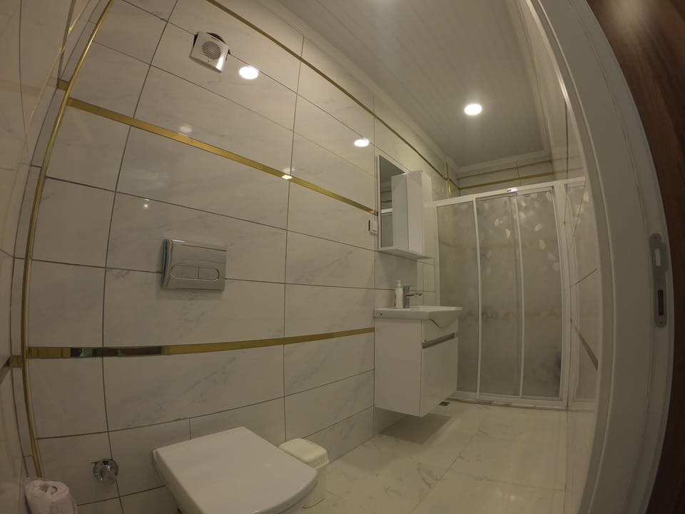 Luxury Apartment, 1 Bedroom | Bathroom | Shower, rainfall showerhead, hair dryer, bathrobes