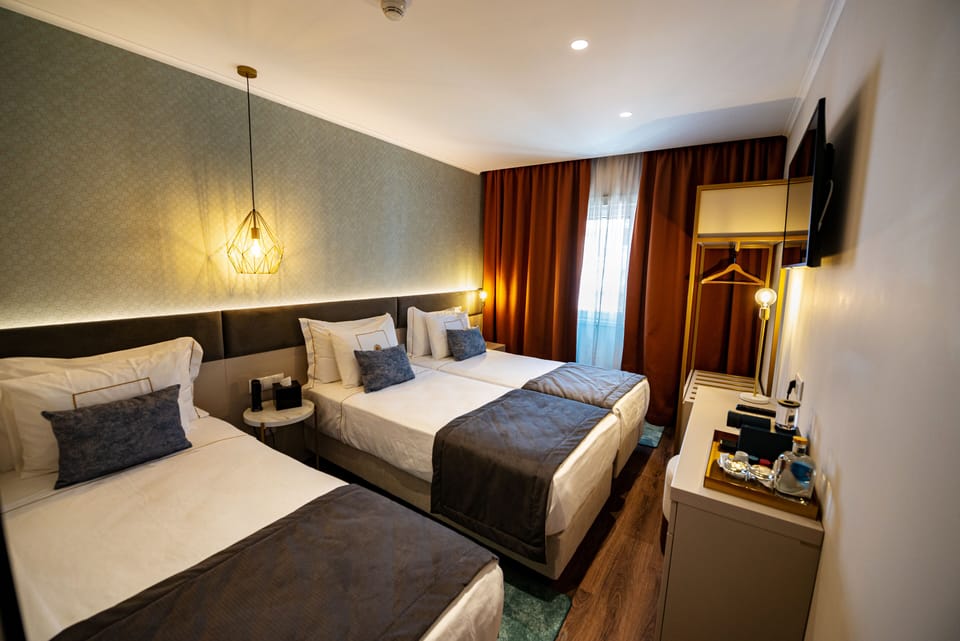 Standard Triple Room | Desk, blackout drapes, soundproofing, free WiFi