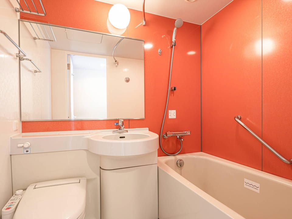 Combined shower/tub, free toiletries, hair dryer, slippers