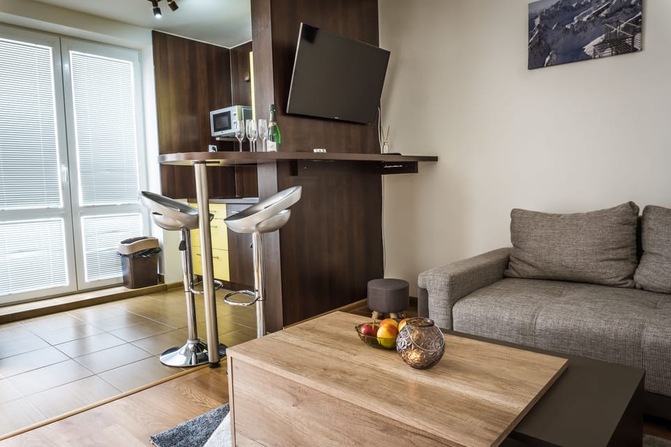 Apartment, 2 Bedrooms (D9) | Living area | Flat-screen TV