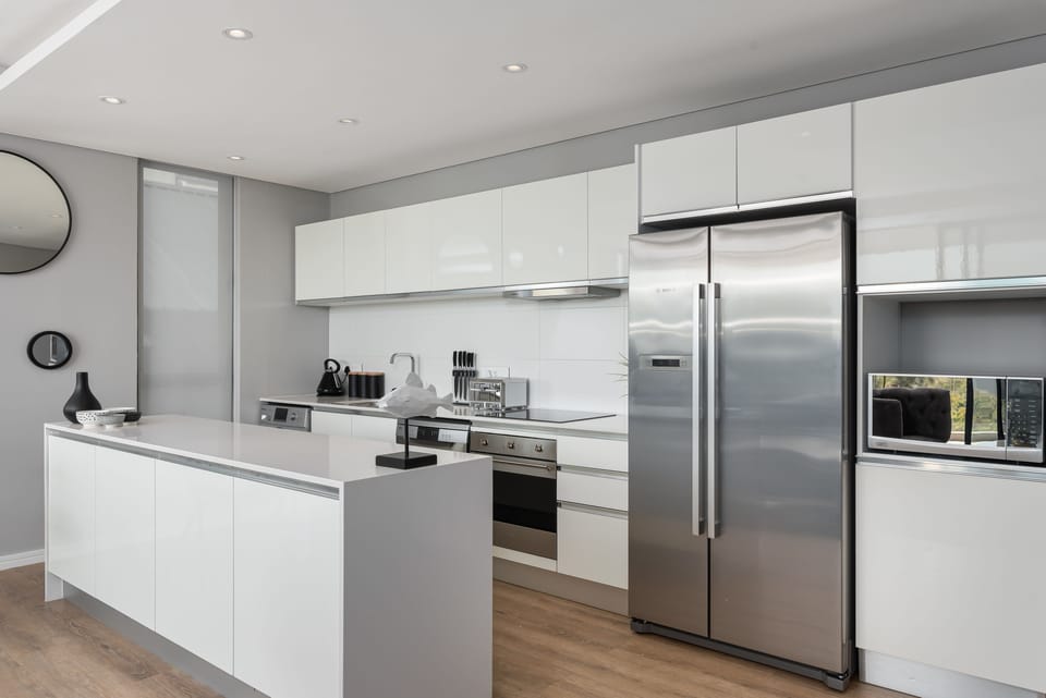 Luxury Apartment | Private kitchen | Full-size fridge, microwave, oven, stovetop