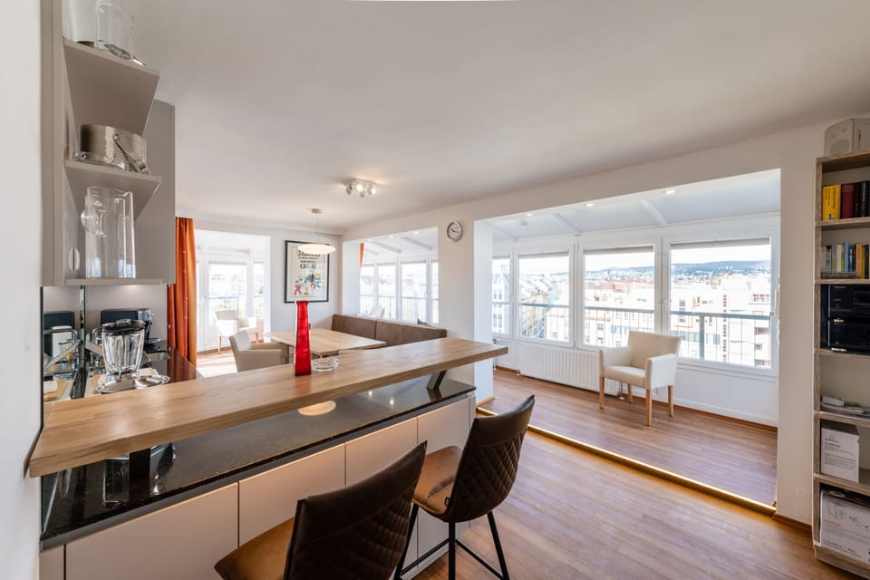 Panoramic Penthouse, 2 Bedrooms, Patio, City View | Living area | Flat-screen TV, heated floors