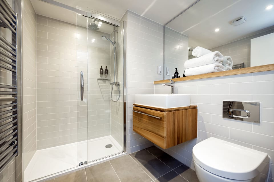 Wilde Two-Bedroom | Bathroom | Shower, rainfall showerhead, towels
