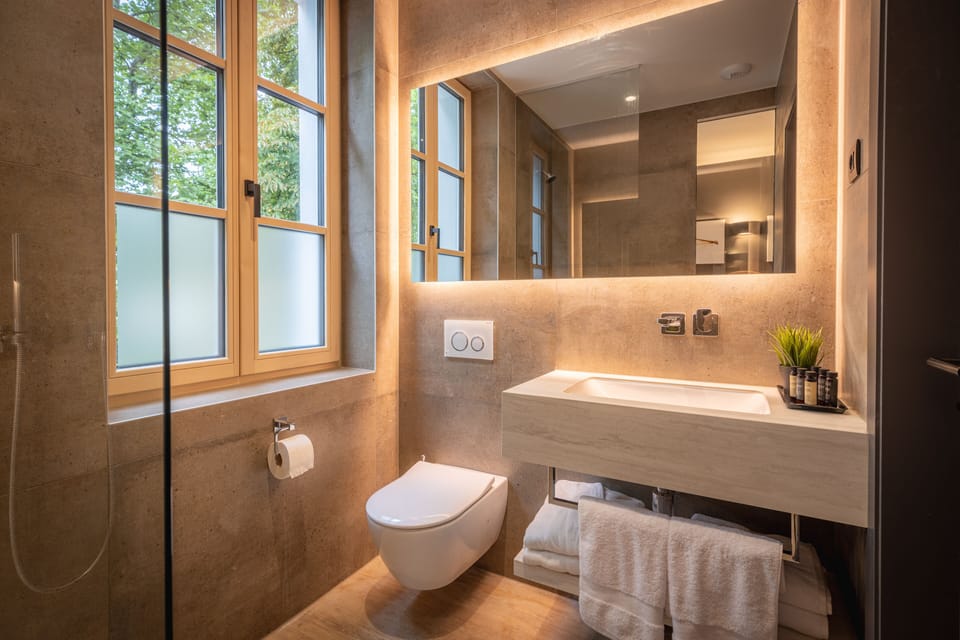 Designer toiletries, hair dryer, bathrobes, slippers