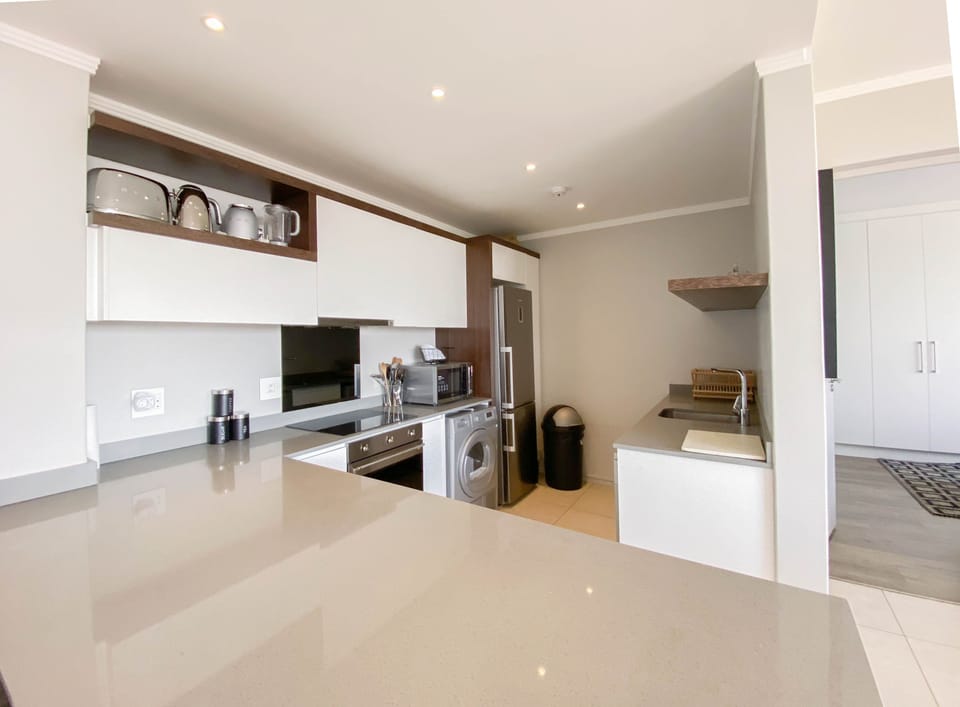 Executive Apartment, 2 Bedrooms | Private kitchen | Stovetop, cookware/dishes/utensils, dining tables