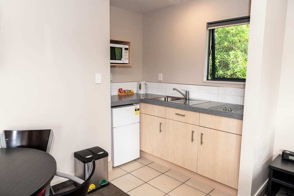 Apartment, 1 Bedroom | Private kitchen | Coffee/tea maker, mini-fridge, electric kettle, cookware/dishes/utensils