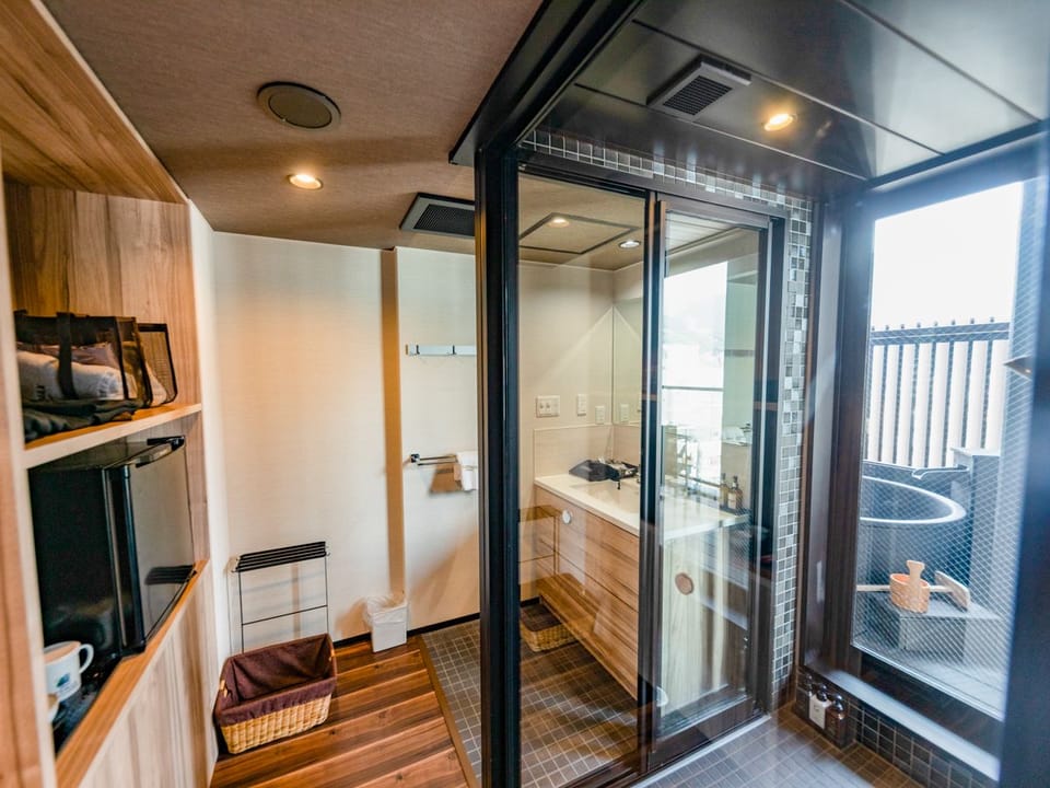Separate tub and shower, free toiletries, hair dryer, slippers