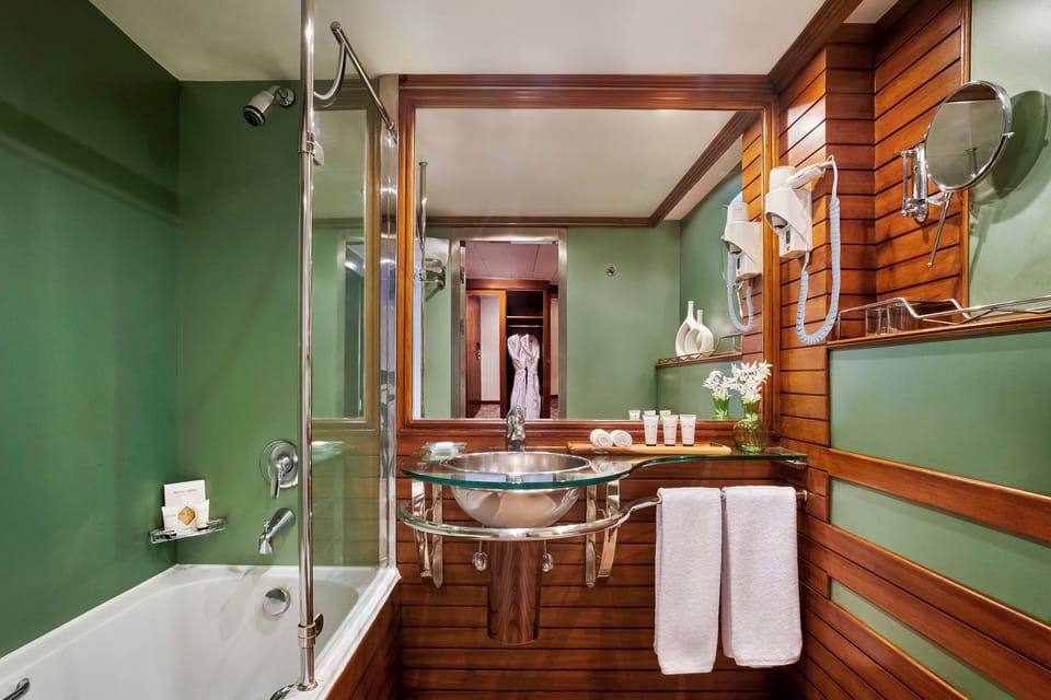 Bathtub, hair dryer, bathrobes, slippers