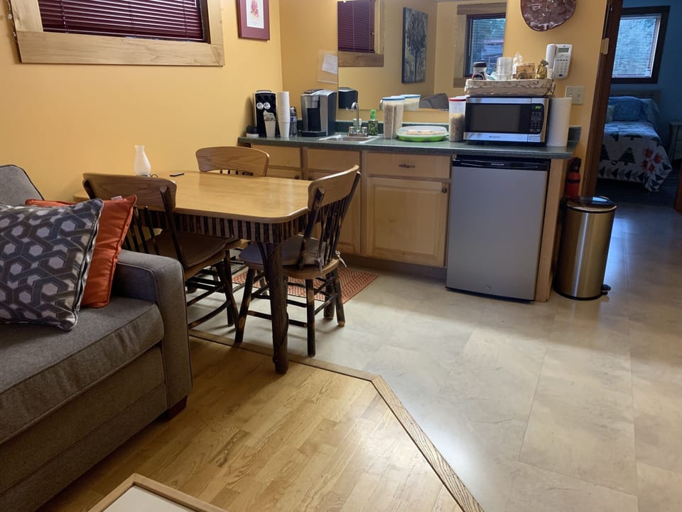 Coffee/tea maker, microwave, toaster, cleaning supplies