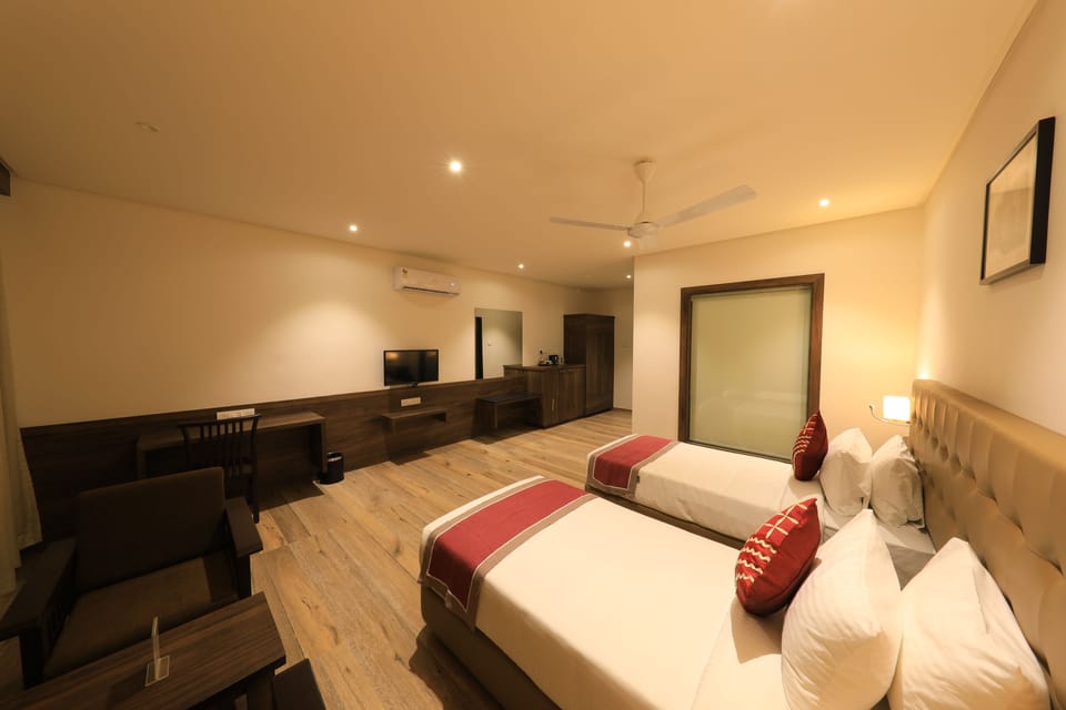 Executive Twin Room | In-room safe, individually decorated, desk, blackout drapes
