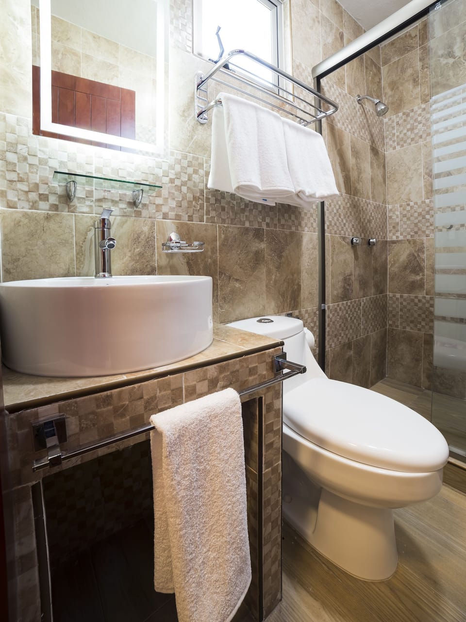 Shower, designer toiletries, towels