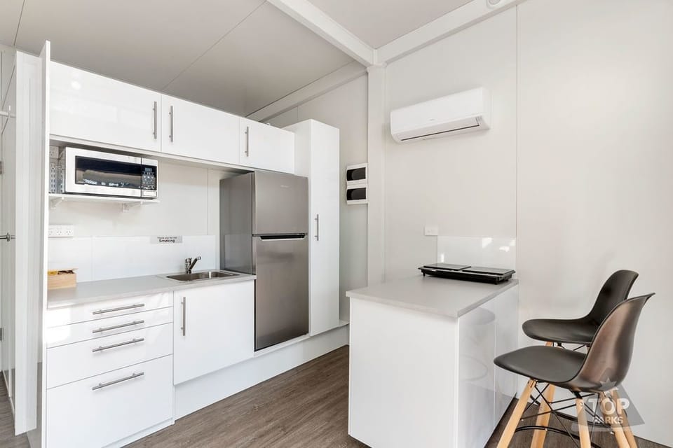 Executive Villa | Private kitchen | Microwave, stovetop, electric kettle, toaster