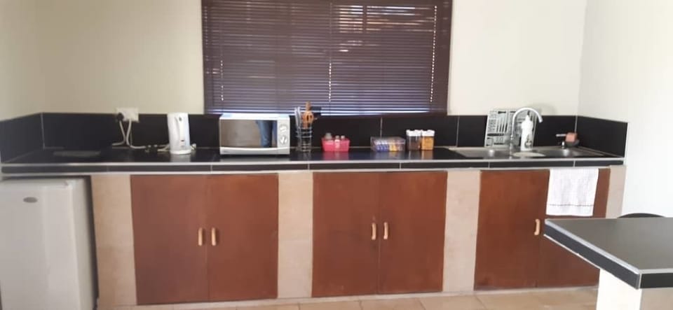 Fridge, microwave, electric kettle, cookware/dishes/utensils