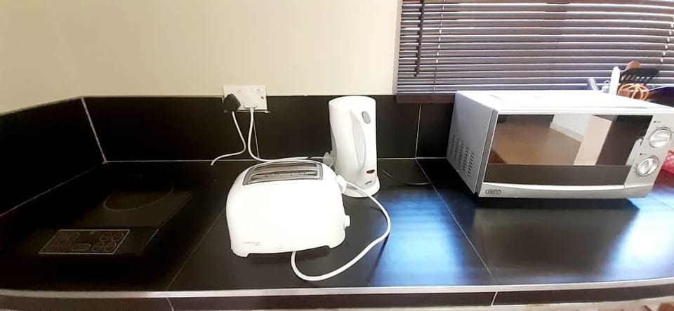 Fridge, microwave, electric kettle, cookware/dishes/utensils