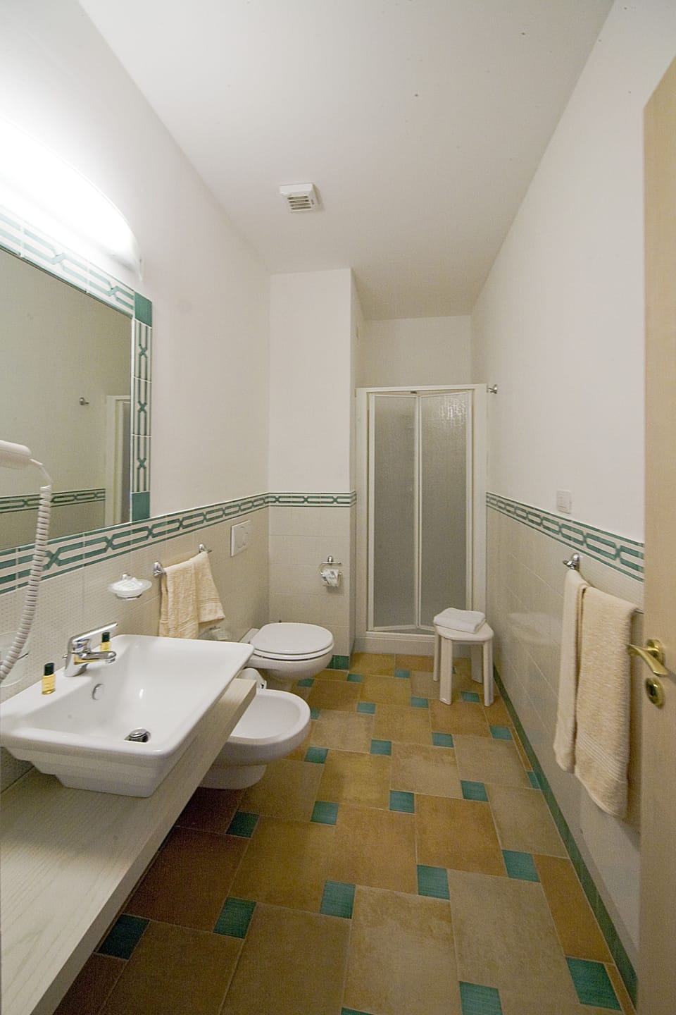 Shower, free toiletries, hair dryer, slippers