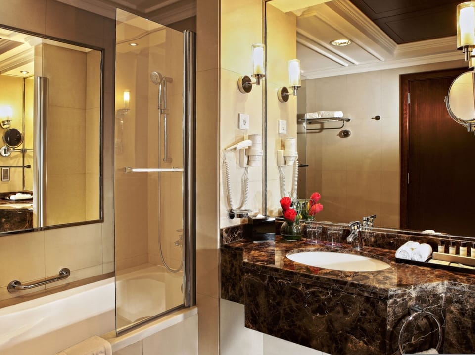 Separate tub and shower, hair dryer, bidet, towels