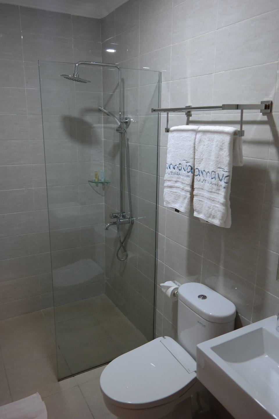 Shower, rainfall showerhead, hair dryer (on request), slippers