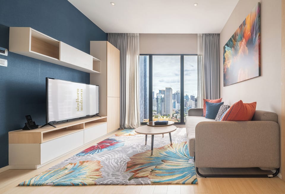 Suite, 1 Bedroom (Sky) | Living area | 49-inch LCD TV with digital channels, TV