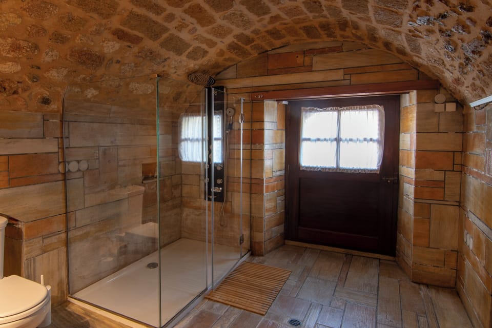 Superior Suite | Bathroom | Hair dryer, slippers, towels, toilet paper