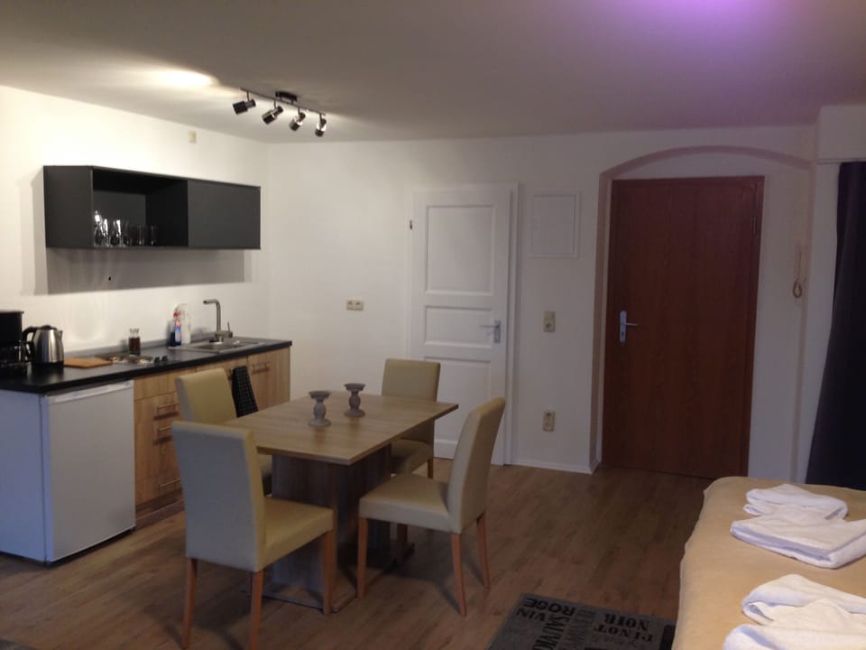 Quadruple Room (Büttner 3) | Living area | Flat-screen TV