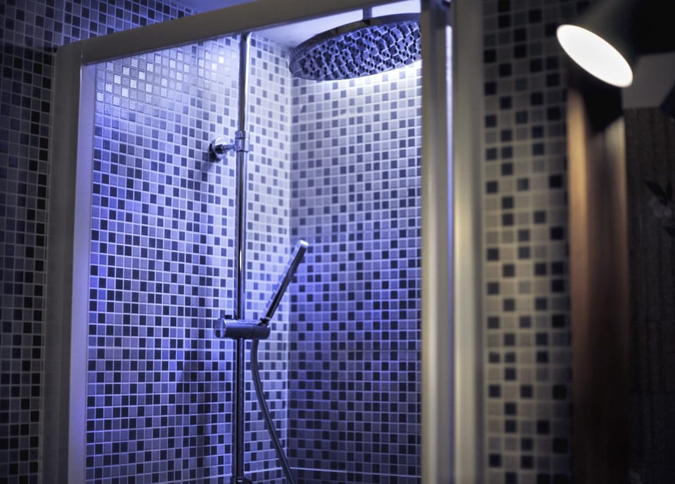 Shower, rainfall showerhead, hair dryer, towels