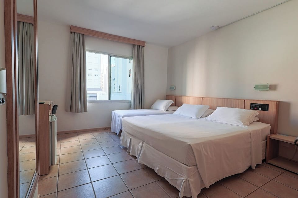 Standard Triple Room | Minibar, in-room safe, blackout drapes, free WiFi