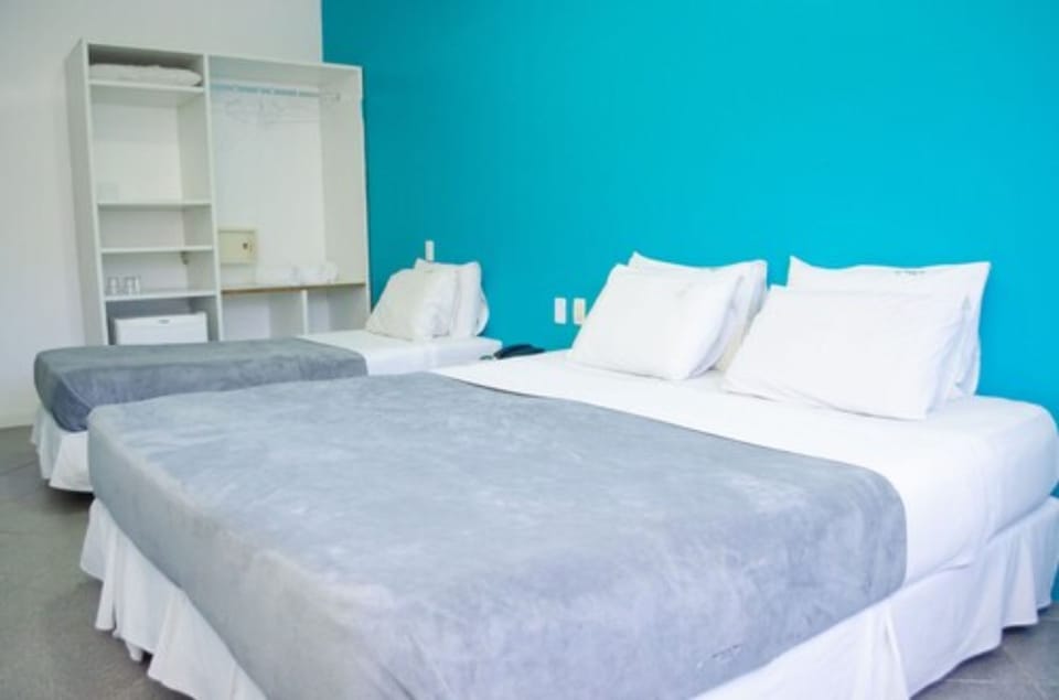 Standard Triple Room, Non Smoking, Private Bathroom | Minibar, blackout drapes, free WiFi, bed sheets