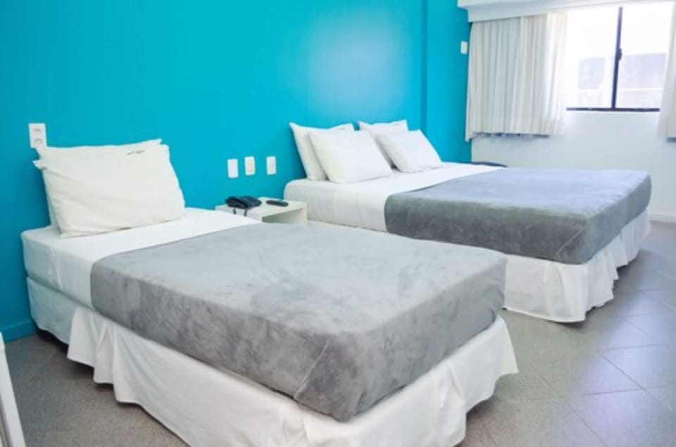 Standard Triple Room, Non Smoking, Private Bathroom | Minibar, blackout drapes, free WiFi, bed sheets