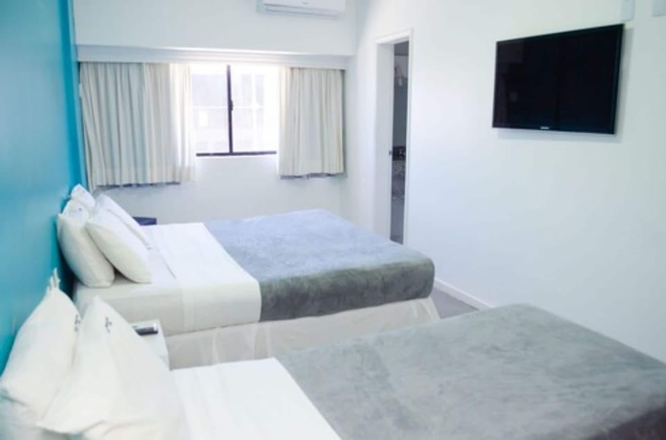 Standard Triple Room, Non Smoking, Private Bathroom | Minibar, blackout drapes, free WiFi, bed sheets