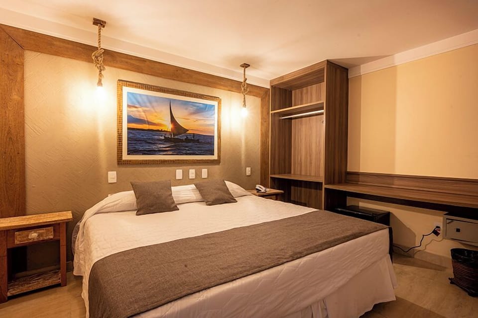 Economy Triple Room | Minibar, in-room safe, blackout drapes, soundproofing