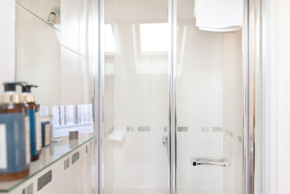 Designer toiletries, hair dryer, bathrobes, slippers