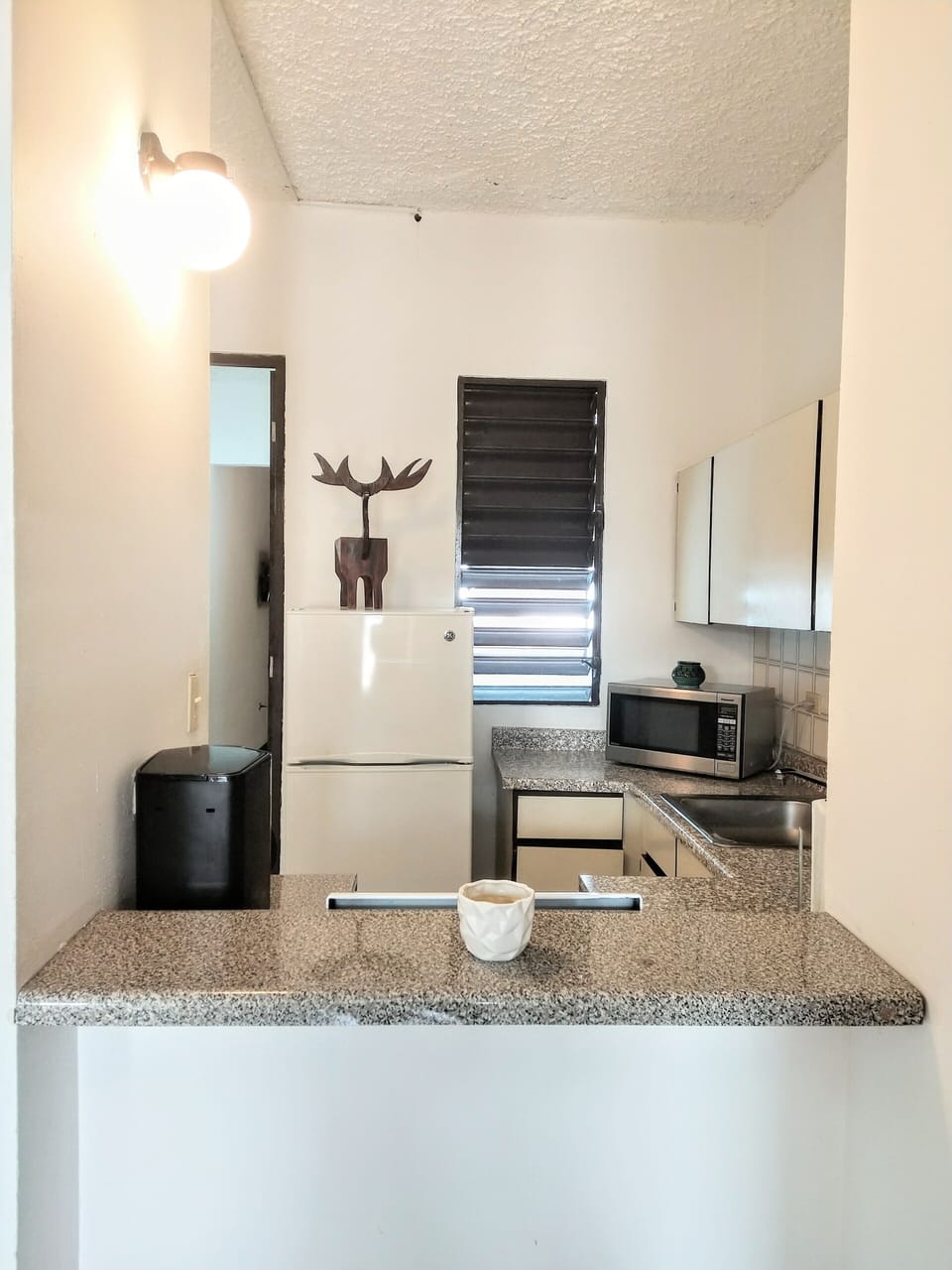 Old San Juan Apartment | Private kitchen | Fridge, microwave, paper towels