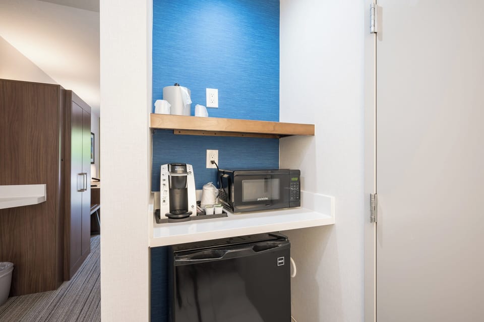 Desk, laptop workspace, blackout drapes, iron/ironing board