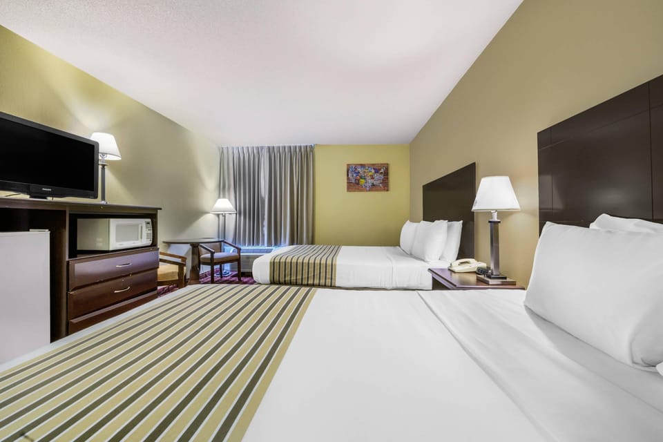 Standard Room, 2 Queen Beds, Non Smoking | Iron/ironing board, free cribs/infant beds, free WiFi, bed sheets