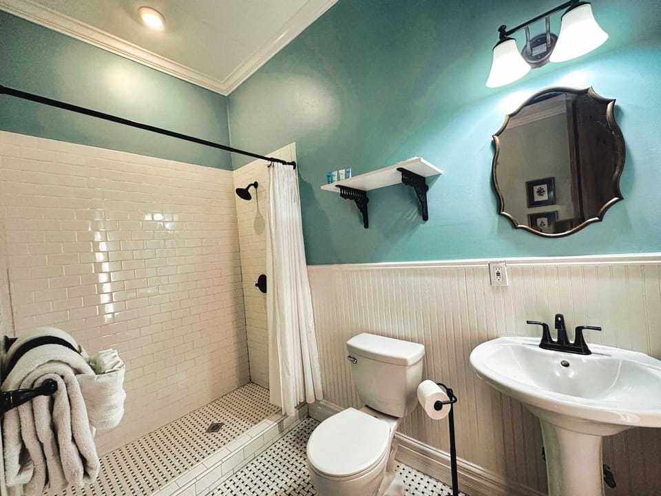 Shower, designer toiletries, hair dryer, bathrobes