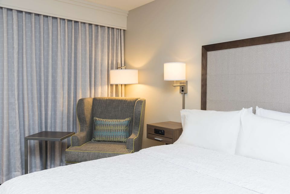 Premium bedding, down comforters, Tempur-Pedic beds, desk