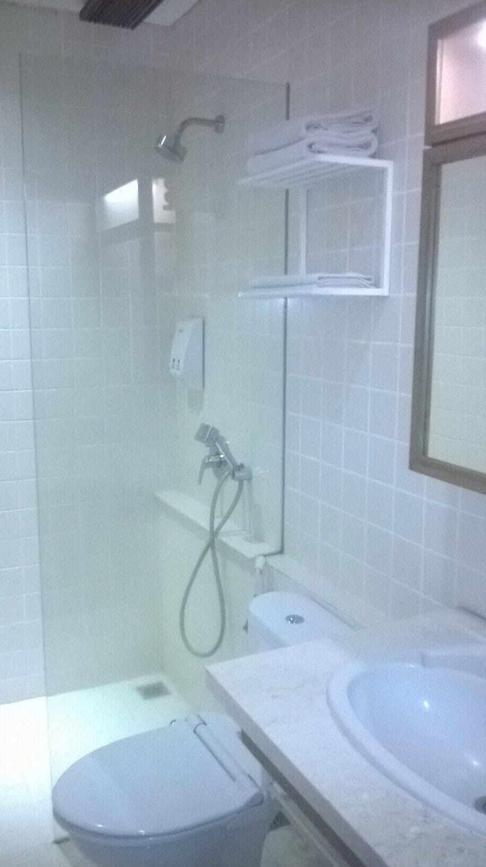 Combined shower/tub, free toiletries, hair dryer, slippers