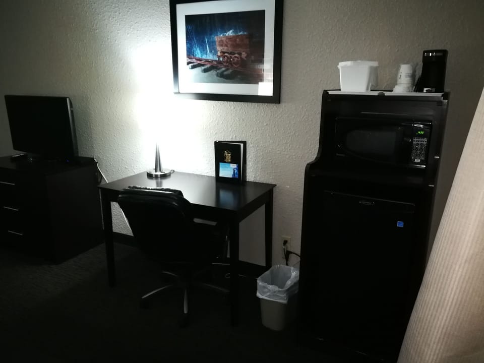 Desk, laptop workspace, iron/ironing board, free cribs/infant beds