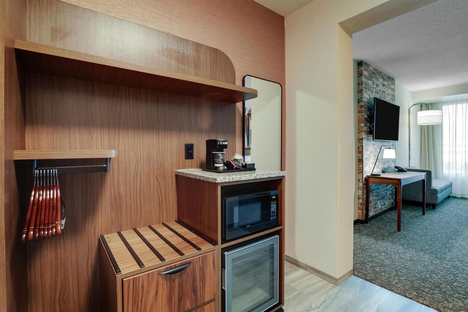 Premium bedding, desk, laptop workspace, blackout drapes